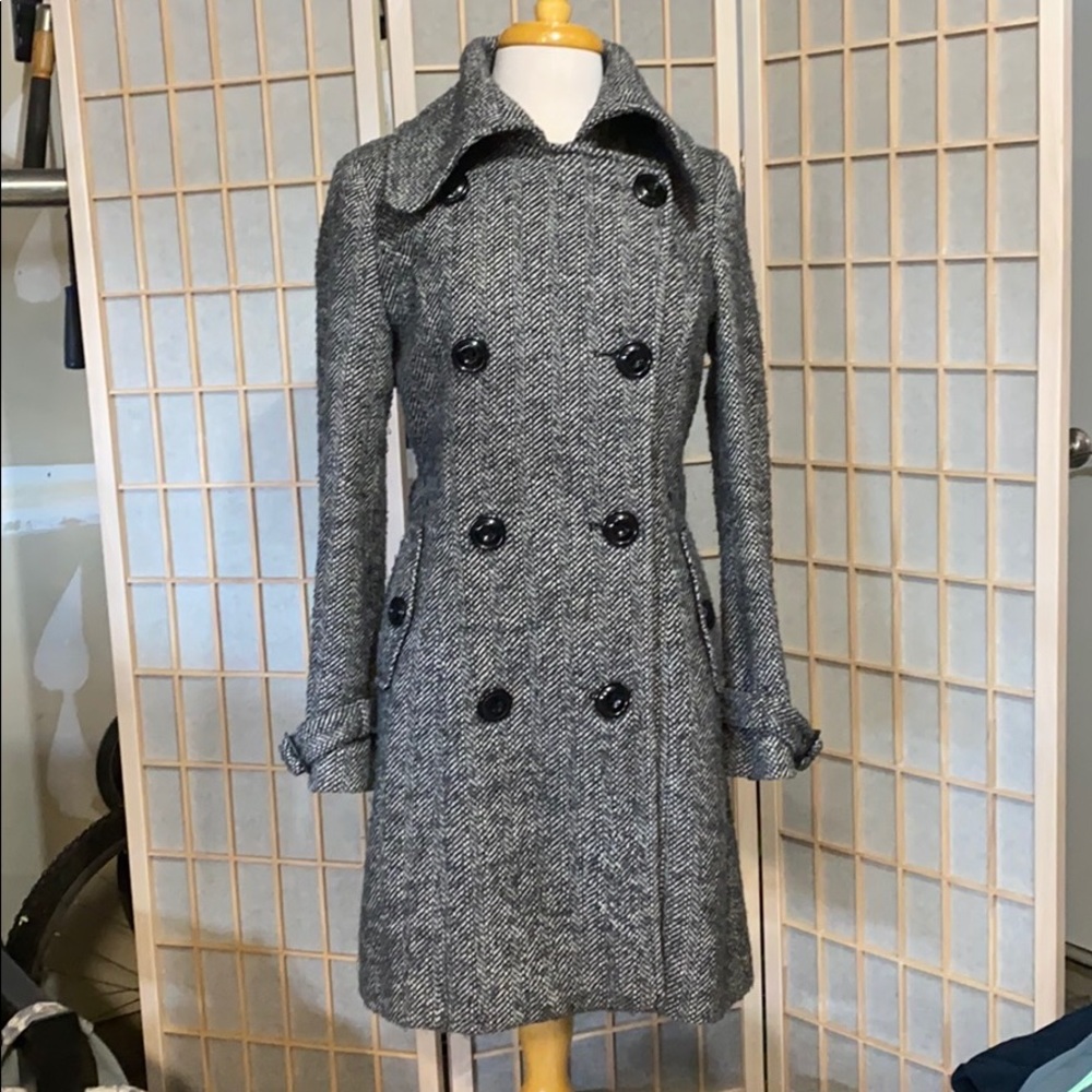 Black and white check trench coat.